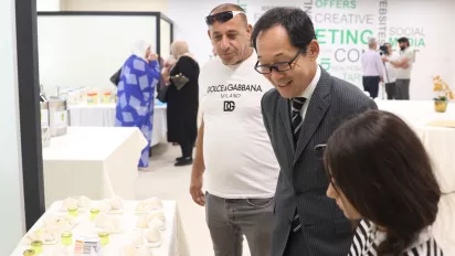 Japanese ambassador checking the produce of exhibitors