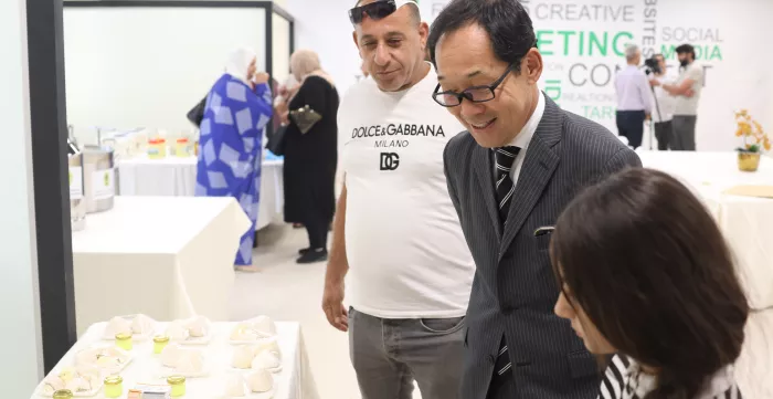 Japanese ambassador checking the produce of exhibitors