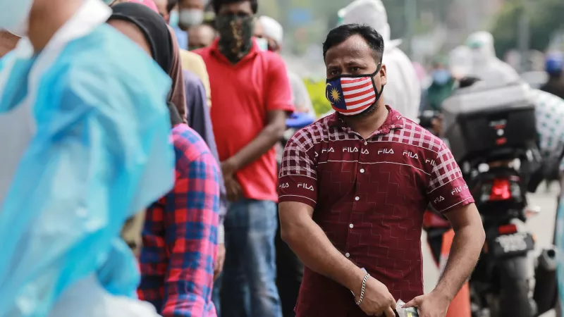 A group of migrant workers in the street in Malaysia