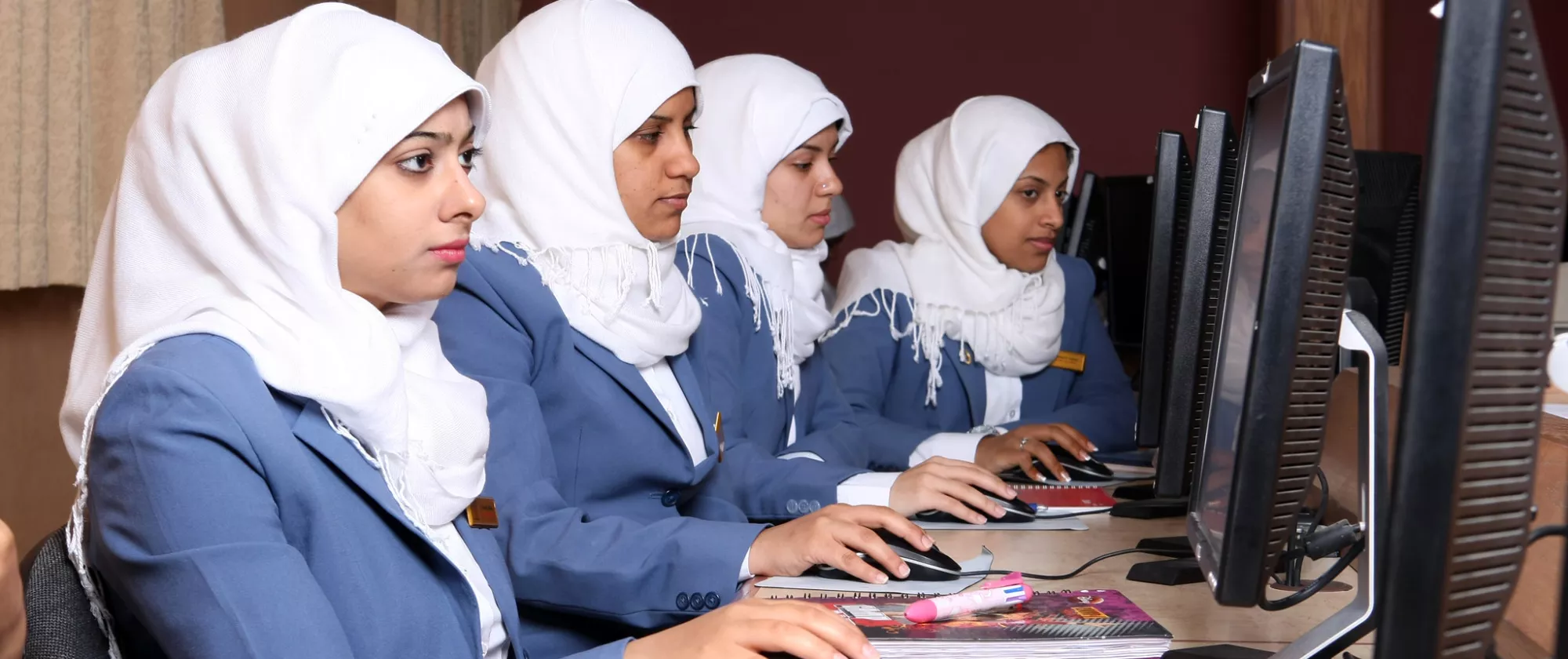 Women following a training on computers